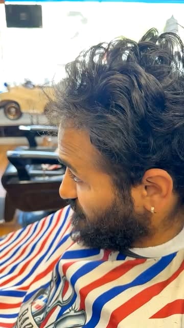 Full beard shaped and lined up with a fade