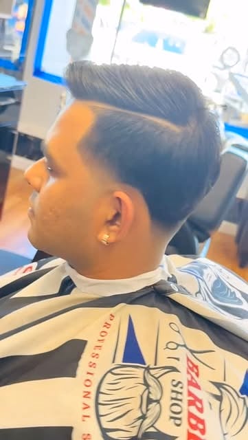 Mid skin fade with a hard part