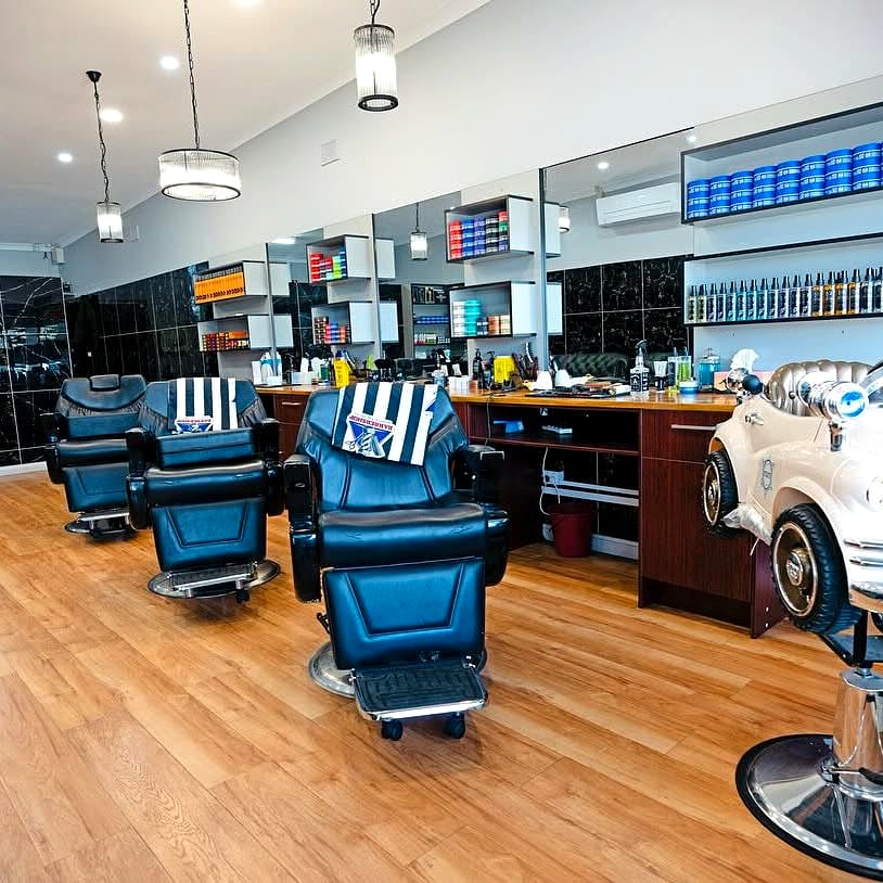 Barber stations and mirrors at STYLO Barbershop